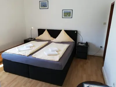 Ein Bett oder Betten in einem Zimmer der Unterkunft Hotel Hohenzollernhof