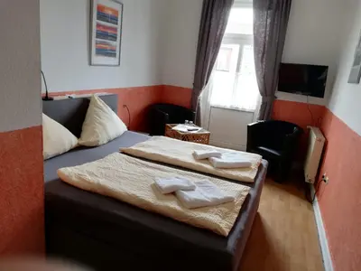 Ein Bett oder Betten in einem Zimmer der Unterkunft Hotel Hohenzollernhof