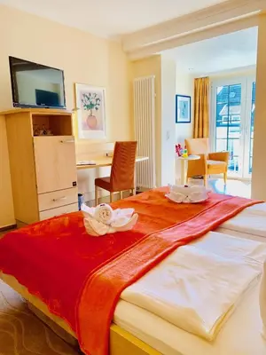 Ein Bett oder Betten in einem Zimmer der Unterkunft Aparthotel Kleine Perle