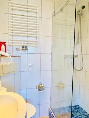 Ein Badezimmer in der Unterkunft Aparthotel Kleine Perle