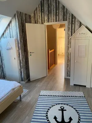 Ein Bett oder Betten in einem Zimmer der Unterkunft Ferienhaus Nordseejuwel