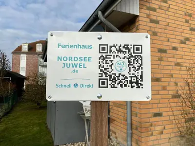 Ein Zertifikat, Auszeichnung, Logo oder anderes Dokument, das in der Unterkunft Ferienhaus Nordseejuwel ausgestellt ist