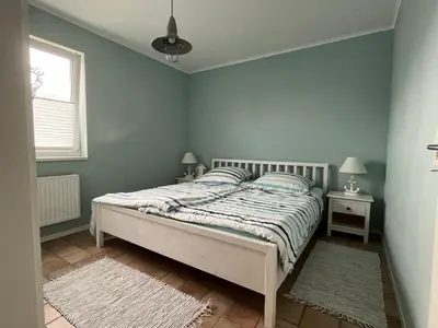Ein Bett oder Betten in einem Zimmer der Unterkunft Ferienhaus Nordseejuwel