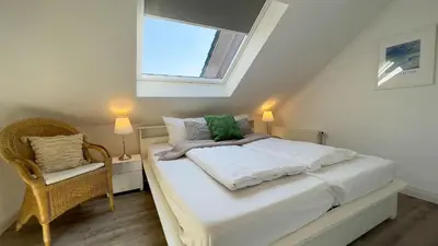 Ein Bett oder Betten in einem Zimmer der Unterkunft Strandrobbe 4