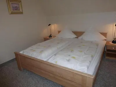 Ein Bett oder Betten in einem Zimmer der Unterkunft westerwarft 10