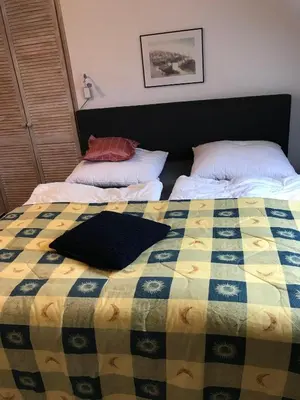 Ein Bett oder Betten in einem Zimmer der Unterkunft Ferienwohnung 307 - mit seitlichem Meerblick