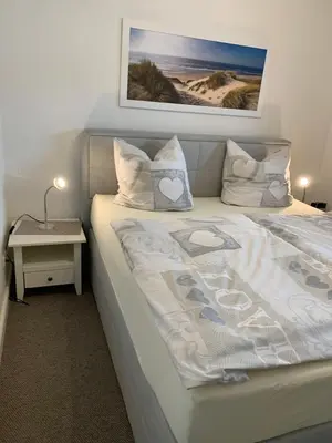 Ein Bett oder Betten in einem Zimmer der Unterkunft Strandresidenz Rosengarten - Wohnung Nr. 108