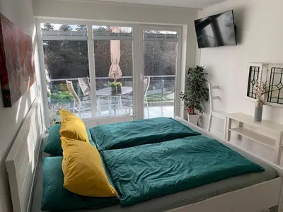 Ein Bett oder Betten in einem Zimmer der Unterkunft Strandhaus Nordseebrandung Fewo A2.5