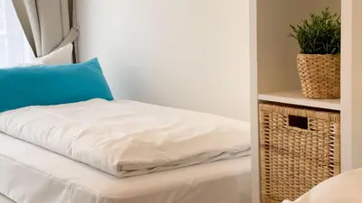 Ein Bett oder Betten in einem Zimmer der Unterkunft Strandhaus Nordseebrandung Fewo B2.1