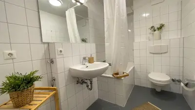 Ein Badezimmer in der Unterkunft Strandhaus Nordseebrandung Fewo B2.1