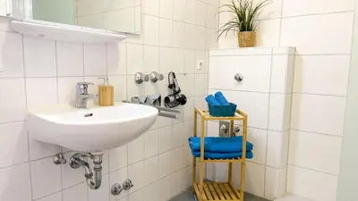 Ein Badezimmer in der Unterkunft Strandhaus Nordseebrandung Fewo B1.2
