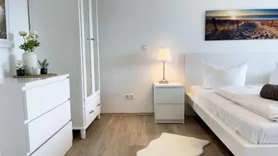 Ein Bett oder Betten in einem Zimmer der Unterkunft Strandhaus Nordseebrandung Fewo B3.2