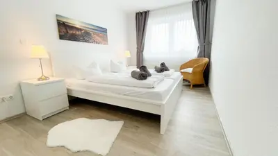 Ein Bett oder Betten in einem Zimmer der Unterkunft Strandhaus Nordseebrandung Fewo B3.1