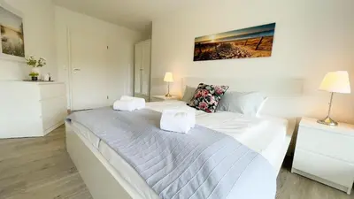 Ein Bett oder Betten in einem Zimmer der Unterkunft Strandhaus Nordseebrandung Fewo B1.3