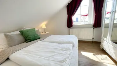 Ein Bett oder Betten in einem Zimmer der Unterkunft Haus Kirsten, Fewo Nr. 5