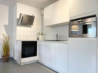 Küche/Küchenzeile in der Unterkunft Strandhaus Nordseebrandung Fewo A1.2