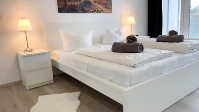 Ein Bett oder Betten in einem Zimmer der Unterkunft Strandhaus Nordseebrandung Fewo A1.2