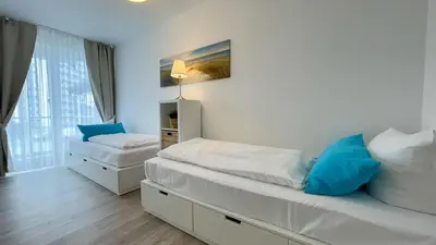 Ein Bett oder Betten in einem Zimmer der Unterkunft Strandhaus Nordseebrandung Fewo A3.1