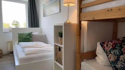 Ein Bett oder Betten in einem Zimmer der Unterkunft Strandhaus Nordseebrandung Fewo D1.4