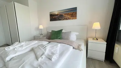 Ein Bett oder Betten in einem Zimmer der Unterkunft Strandhaus Nordseebrandung Fewo D1.5