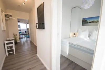 Ein Bett oder Betten in einem Zimmer der Unterkunft Am Sahlenburger Strand - Wohnung 4