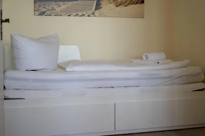 Ein Bett oder Betten in einem Zimmer der Unterkunft Frische Brise 15.09