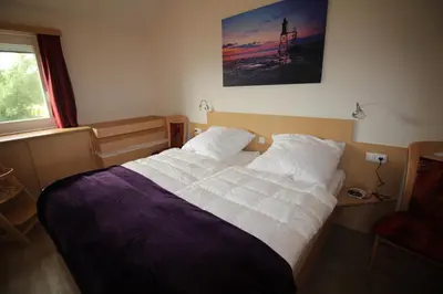 Ein Bett oder Betten in einem Zimmer der Unterkunft Ferienhaus Nixe7