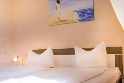 Ein Bett oder Betten in einem Zimmer der Unterkunft Frauenpreis Whg. 205