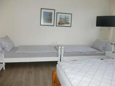Ein Bett oder Betten in einem Zimmer der Unterkunft Ferienwohnung Plett