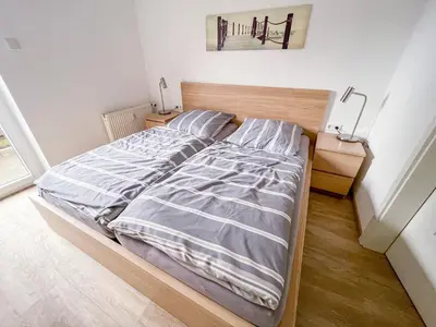 Ein Bett oder Betten in einem Zimmer der Unterkunft Appartementhaus Nige Ooge Ferienwohnung Nr. 1