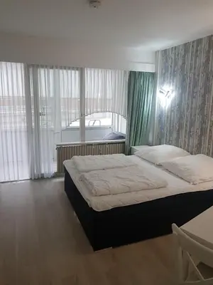 Ein Bett oder Betten in einem Zimmer der Unterkunft Gemütliches Apartment direkt am Strand