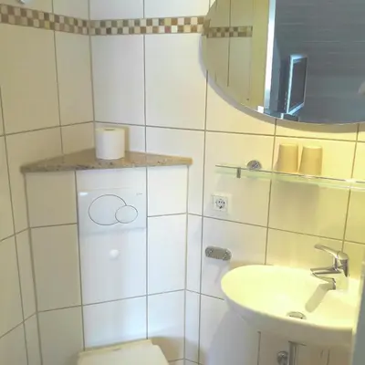 Ein Badezimmer in der Unterkunft Ferienwohnung Konradi Cuxhaven-Duhnen