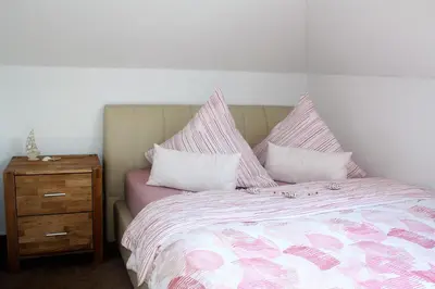 Ein Bett oder Betten in einem Zimmer der Unterkunft Ferienwohnung Konradi Cuxhaven-Duhnen