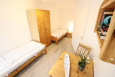 Ein Bett oder Betten in einem Zimmer der Unterkunft Haus Nordseebrandung