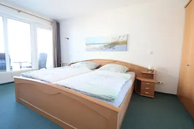 Ein Bett oder Betten in einem Zimmer der Unterkunft Haus Nordseebrandung