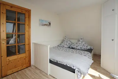 Ein Bett oder Betten in einem Zimmer der Unterkunft Ferienhaus Kiebitz mit Sauna