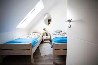 Ein Bett oder Betten in einem Zimmer der Unterkunft Ferienwohnungen in Wremen