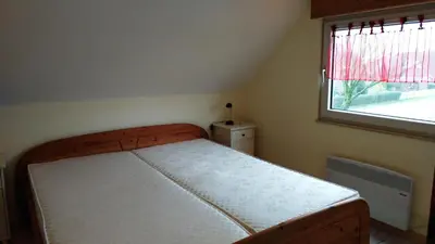 Ein Bett oder Betten in einem Zimmer der Unterkunft Haus Spitzenblick