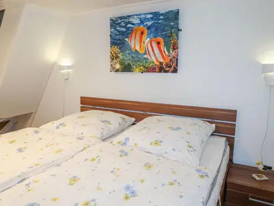 Ein Bett oder Betten in einem Zimmer der Unterkunft Apartment Osterende-2 by Interhome