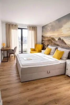 Ein Bett oder Betten in einem Zimmer der Unterkunft Hotel Deichgraf
