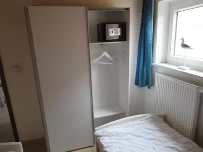 Ein Bett oder Betten in einem Zimmer der Unterkunft Ferienhäuser Seemannsgarn
