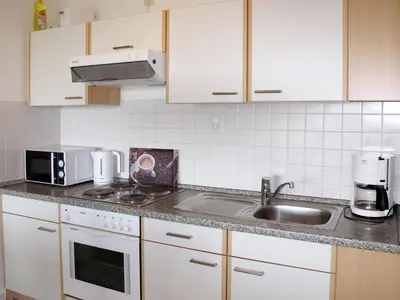 Küche/Küchenzeile in der Unterkunft Apartment Cuxland Ferienpark-2 by Interhome