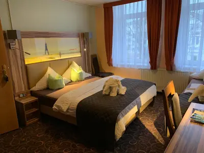 Ein Bett oder Betten in einem Zimmer der Unterkunft Hotel Seemeile
