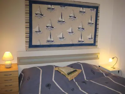 Ein Bett oder Betten in einem Zimmer der Unterkunft Am Hafen IS