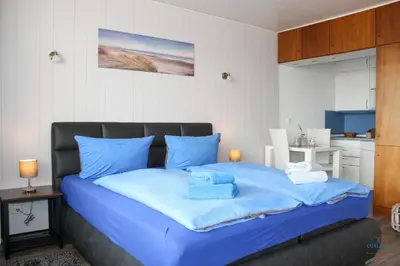 Ein Bett oder Betten in einem Zimmer der Unterkunft Haus Atlantic Whg. 607B