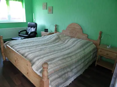 Ein Bett oder Betten in einem Zimmer der Unterkunft Ferienhaus Regenbogen