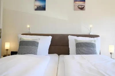 Ein Bett oder Betten in einem Zimmer der Unterkunft Strandhotel Salty