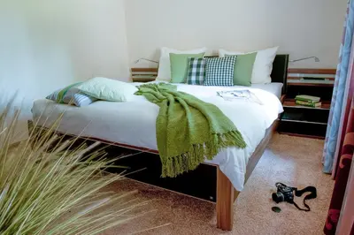 Ein Bett oder Betten in einem Zimmer der Unterkunft Ferienhaus Yvonne - [#55027]