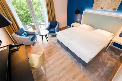 Ein Bett oder Betten in einem Zimmer der Unterkunft Boutique-Hotel Zur alten Post