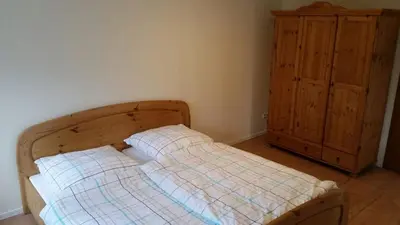 Ein Bett oder Betten in einem Zimmer der Unterkunft Ferienwohnung Waterkant